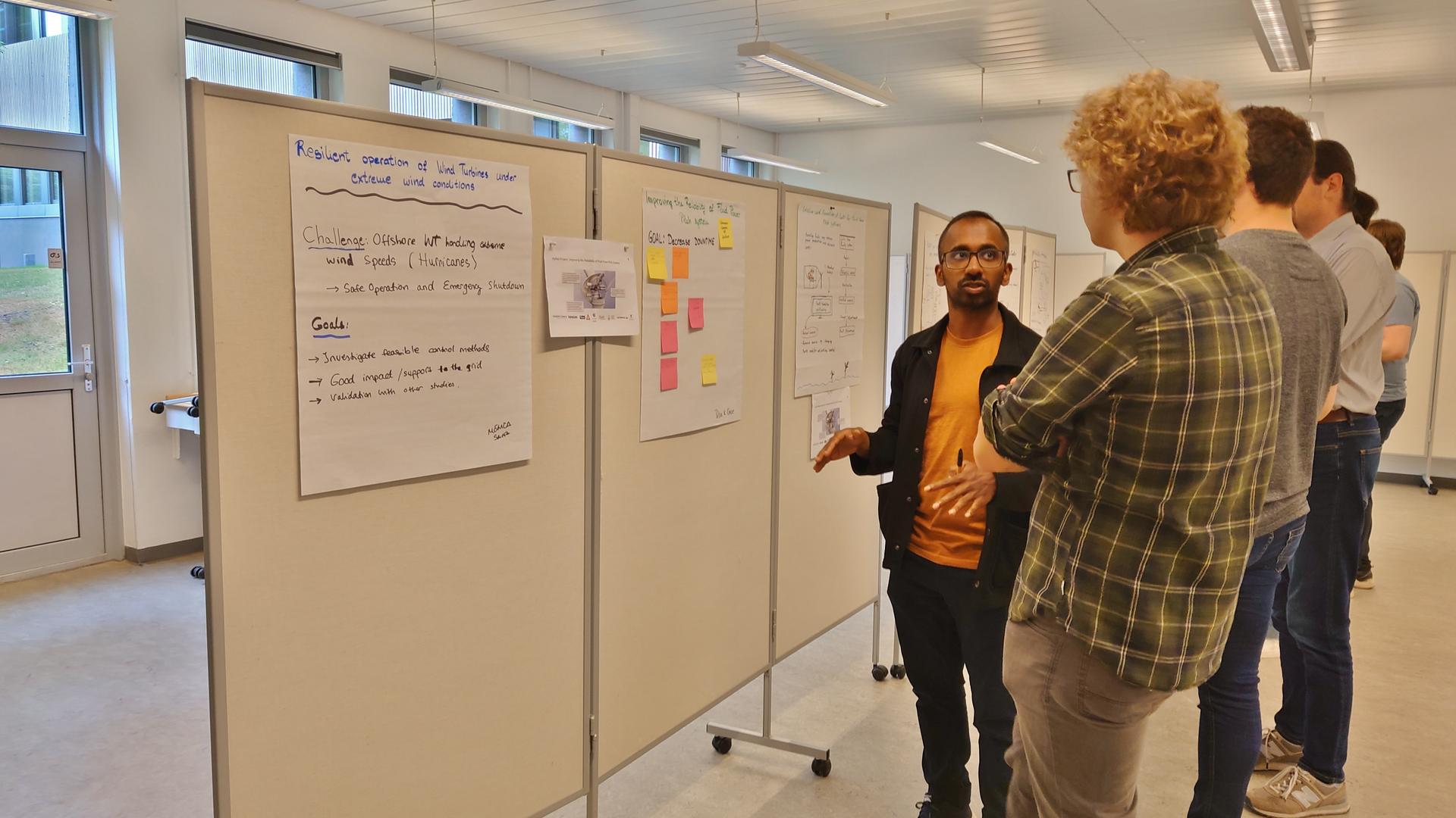 Discussion in front of the boards with ideas Discussion in front of the boards with ideas